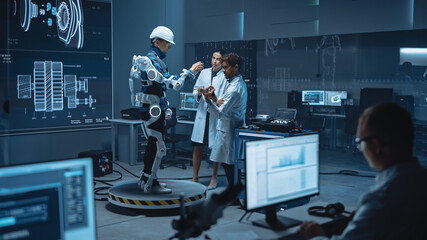 Poster - In Robotics Development Laboratory: Engineers and Scientists Work on a Bionics Exoskeleton Prototype with Person Testing it. Designing Wearable Exosuit to Help Disabled People, Warehouse Workers