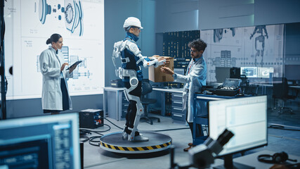 Poster - In Development Laboratory: Engineers Work on a Robotic Exoskeleton with a Person Testing it by Trying to Lift Heavy Cardboard Box. Designing Wearable Exosuit to Help Hard Labor Warehouse Workers