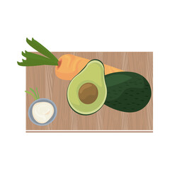 Sticker - half avocado and carrot in wooden kitchen board