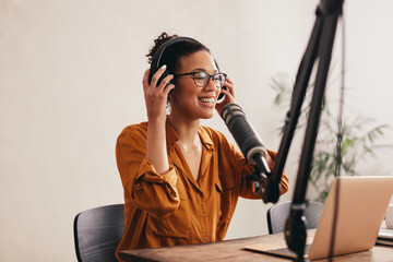 Wall Mural - Podcaster recording her podcast from home