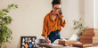 © Jacob Lund - Drop shipping business owner confirming the order on phone