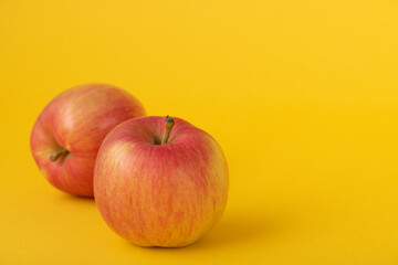 red apples on a yellow background