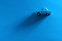 Blue Toy Car On A Blue Background.
