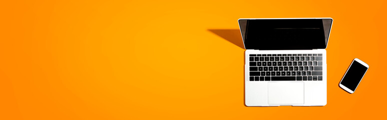 Laptop computer with a smartphone from above