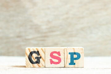 Sticker - Alphabet letter in word GSP (Abbreviation of Good Storage Practice or Generalized System of Preferences or Gross State Product) on wood background