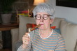 Senior woman smoking a cigar