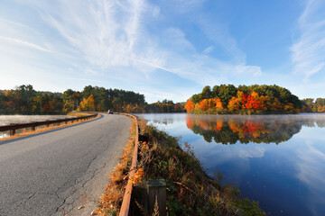 Wall Mural - Beautiful New England Fall Foliage with water reflections at sunrise , Boston Massachusetts.