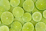 Fototapeta Panele - Tip view of stacked lime slices