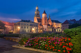 Fototapeta Góry - Wawel castle and Wawel cathedral seen from colorful garden in the night, Krakow, Poland