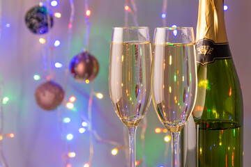 New Year Toast champagne , Christmas lights background