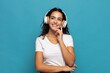 © kues1 - young hispanic woman smiling happily and daydreaming or doubting, looking to the side