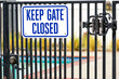 © MichaelVi - Keep Gate Closed warning sign on the locked entrance door to outdoor pool to remind people to keep the swimming pool gate closed
