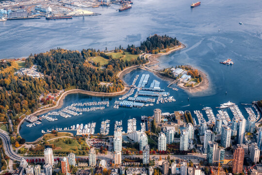 aerial view of coal harbour and a modern downtown city during a vibrant sunny morning. taken in vanc