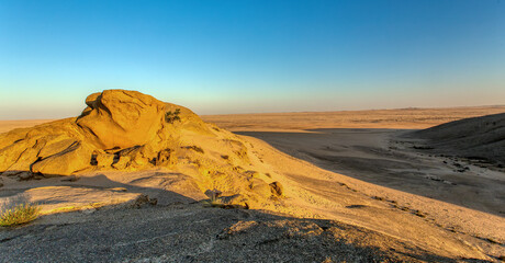 Landscape in Vogelfederberg, interesting rock formation in Namib desert in sunset, Namibia wilderness, Africa nature