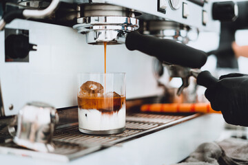 Wall Mural - Make coffee from the machine,The barista is brewing milk coffee.