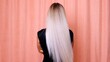© Евгения Медведева - Slow-motion shooting of a long blond hair of a young girl, backside view. Hair care concept.