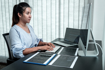 Wall Mural - female programmer working in software javascript computer in it office, writing codes and data code 