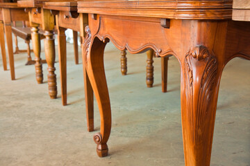 Wall Mural - Detail of an old carved italian wooden table with floral elements just restored