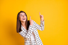 Photo Of Amazed Business Woman Dressed Checkered Blazer Pointing Looking Empty Space Two Fingers Isolated Yellow Color Background