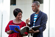 © vystekimages - portrait of handsome man and beautiful businesswoman outdoors