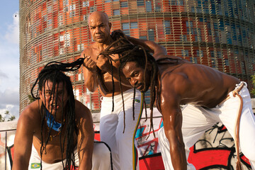 Sticker - capoeira team training in the central square of the city.