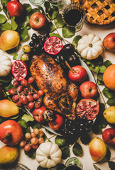 Wall Mural - Autumn Thanksgiving, Friendsgiving, family party gathering celebration dinner. Flat-lay of Fall decorated table with roasted duck in seasonal fruits and vegetables, apple pie and drinks in glasses