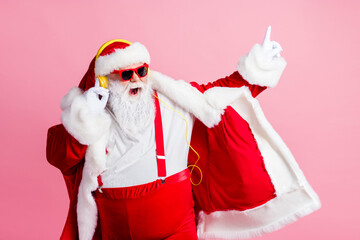 Poster - Photo of crazy funky santa claus enjoy listen x-mas christmas newyear fairy radio song headphones wear sunglass pants suspenders isolated over pastel color background