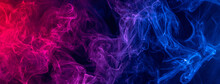 Conceptual Image Of Colorful Red And Blue Color Smoke On Dark Black Background.