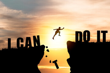 Wall Mural - Silhouette man jumping over cliffs for I can do it , good mindset by never give up concept.