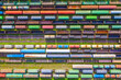 Freight trains made up of multi-colored wagons, aerial view.