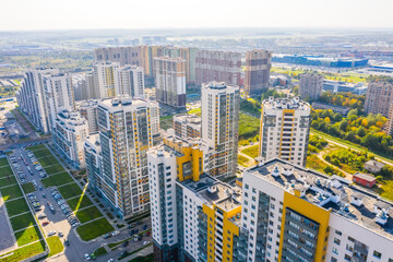 Wall Mural - Panoramic aerial view of the city with multi-storey residential buildings and highways.