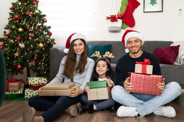 Wall Mural - Latin family with many Christmas presents