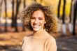 © Andrey_Arkusha - Hairstyle curly hair, portrait of a young blonde girl in an autumn park