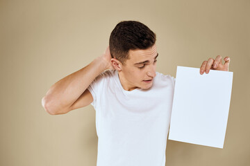 man holding white sheet of paper in hand billboard copy space office