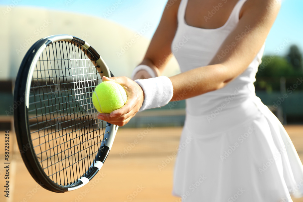 Sportswoman preparing to serve tennis ball at court, closeup - obrazy, fototapety, plakaty 