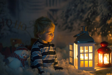 Canvas Print - Little boy, looking at flame from match, sitting in the snow