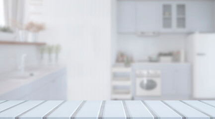 Empty white wooden top table with blurred kitchen room interior Background. for product display montage.