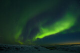 Fototapeta Tęcza - Night sky. Northern Lights. Hills in winter in snow.