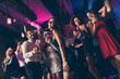 © deagreez - Photo portrait low angle of big group dancing at party with champagne glasses