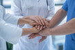 © zinkevych - Close-up of hospital team putting hands together