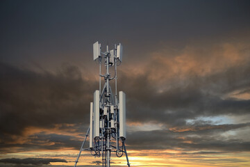 Wall Mural - 4G and 5G cellular. Macro Base Station or Base Transceiver Station. Telecommunication tower. Wireless Communication Antenna Transmitter at dark sunset background.