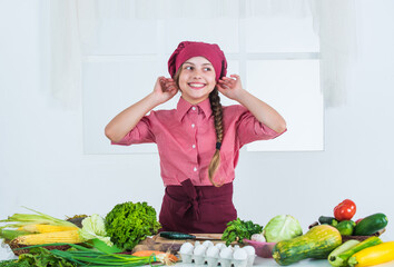 so lovely. Green vegetarian food. girl with variety of vitamins. dieting and health. kid having fun with food vegetables at kitchen. Child and vegetables. Healthy eating and lifestyle concept