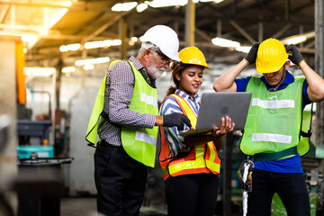 Wall Mural - Professional Mechanical Engineer team Working on Personal Computer at Metal lathe industrial manufacturing factory. Engineer Operating  lathe Machinery. Product quality Inspection