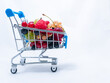 © Kate - Mini grocery cart filled with fresh vitamin berries isolated on white background