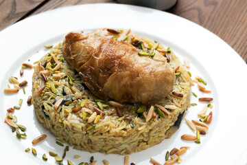 Chicken Maklube. Arabic traditional food made of rice, vegetable and chicken.