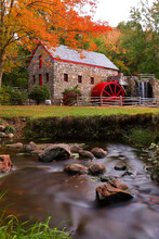 The Wayside Inn Grist Mill With Water Wheel And Cascade Water Fall In Autumn. 