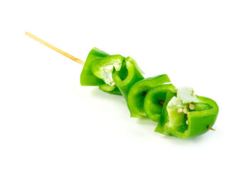 Sticker - green chopped sweet bell pepper with wood skewer isolated on white background