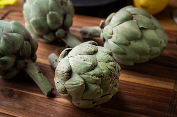 Wall Mural - artichoke on wooden board at kitchen