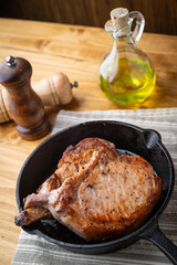 Wall Mural - pan fried pork chop in skillet pan