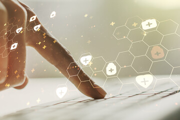 Creative concept of abstract medical illustration and hands typing on laptop on background. Medicine and healthcare concept. Multiexposure
